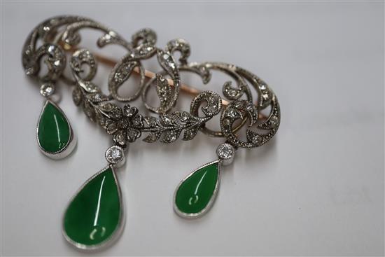 A 1920s yellow metal, diamond and jadeite set drop openwork scroll brooch, width 38mm.